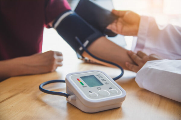 doctor-measuring-blood-pressure-from-her-patient_11304-1291