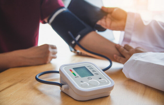 doctor-measuring-blood-pressure-from-her-patient_11304-1291